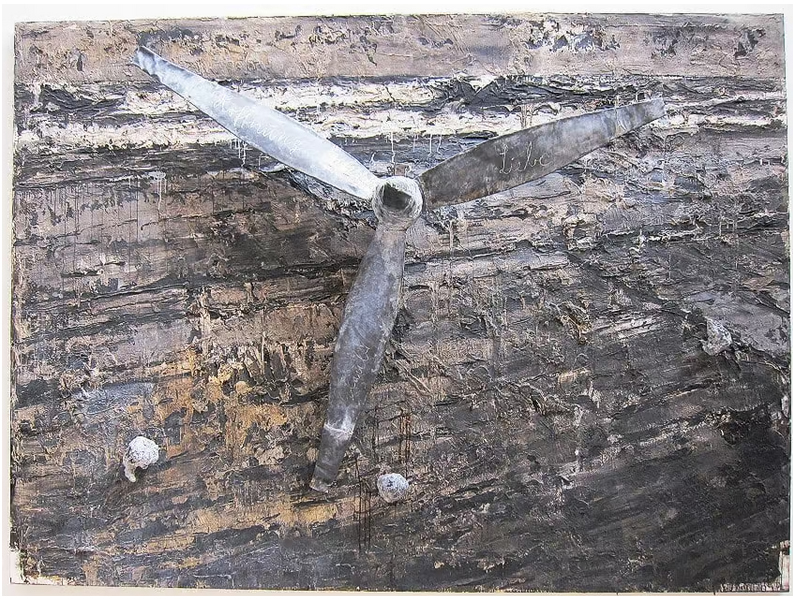 A painting of a propeller on a piece of wood.