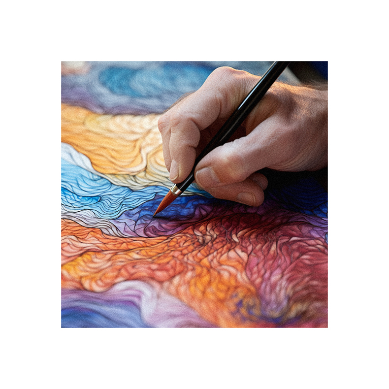 A person is painting with a brush on a colorful painting.