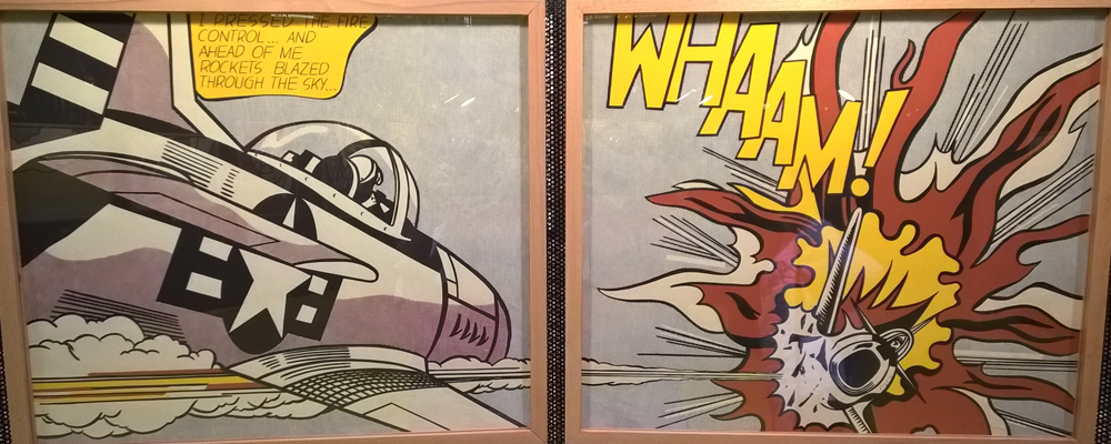 A pair of framed pop art paintings with a plane and a jet.