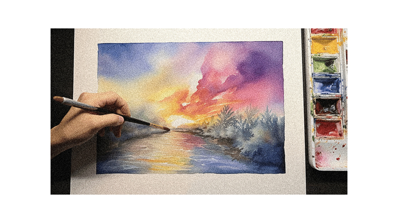 A person is painting a watercolor painting of a sunset.