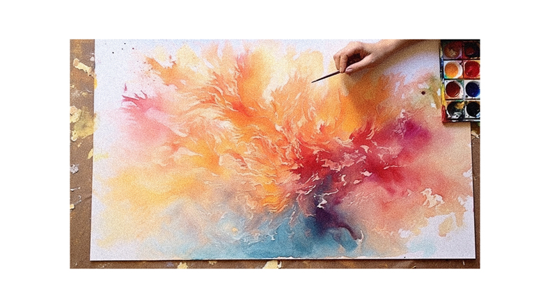 A person is painting a watercolor painting on a piece of paper.