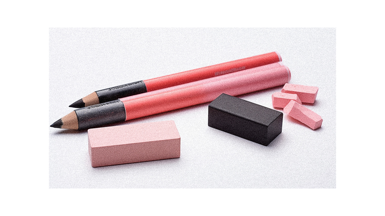 A pink and black pencil and a pink and black block.