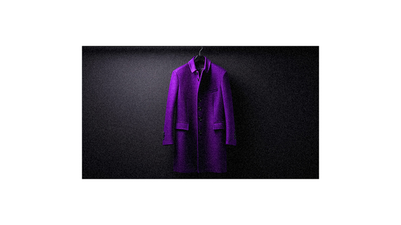 A purple coat hanging on a black wall.