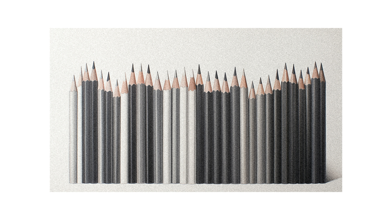 A group of pencils in a row on a white background.