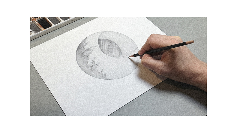 A person is drawing a circle on a piece of paper.