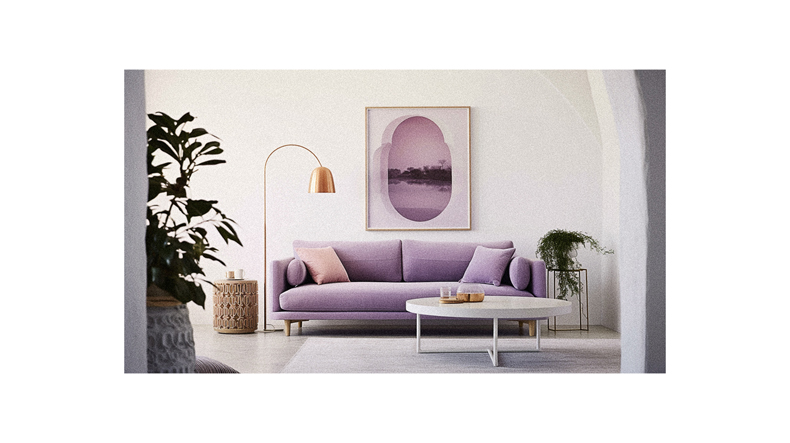 A living room with a purple couch.